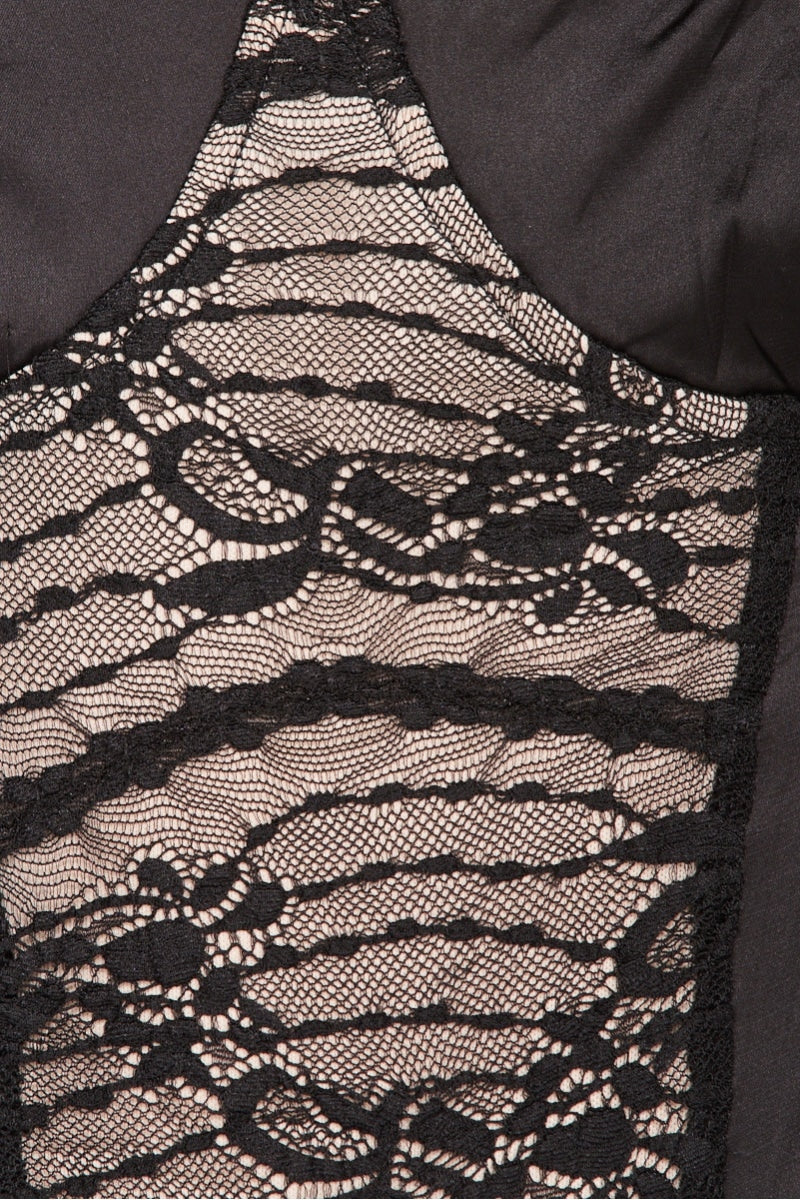 closeup of bodysuit with beige and black statin with black lace.