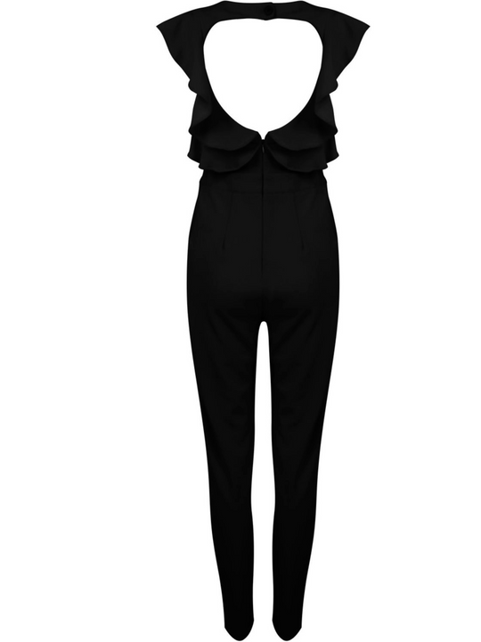 Ghost manequin wears sleeveless black jumpsuit with pleated frill sides and  open back. The jumpsuit has a concealed zip back fastening. The ghost manequin stands with their back to the camera. The back of the jumpsuit can be seen includding the open back and the concealed zip fastening. 