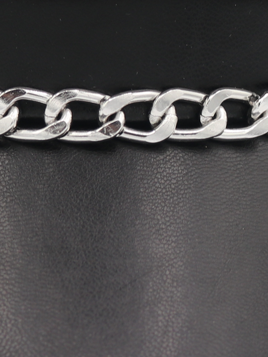 Extreme close up of the PU leather hat, showing the silver linked chain that sits at the front of the PU leather look baker boy hat. 